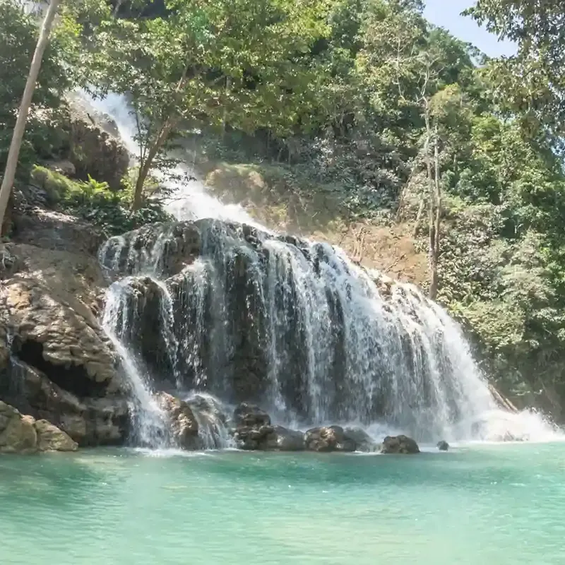 Lapopu Waterfall cascading over rock terraces