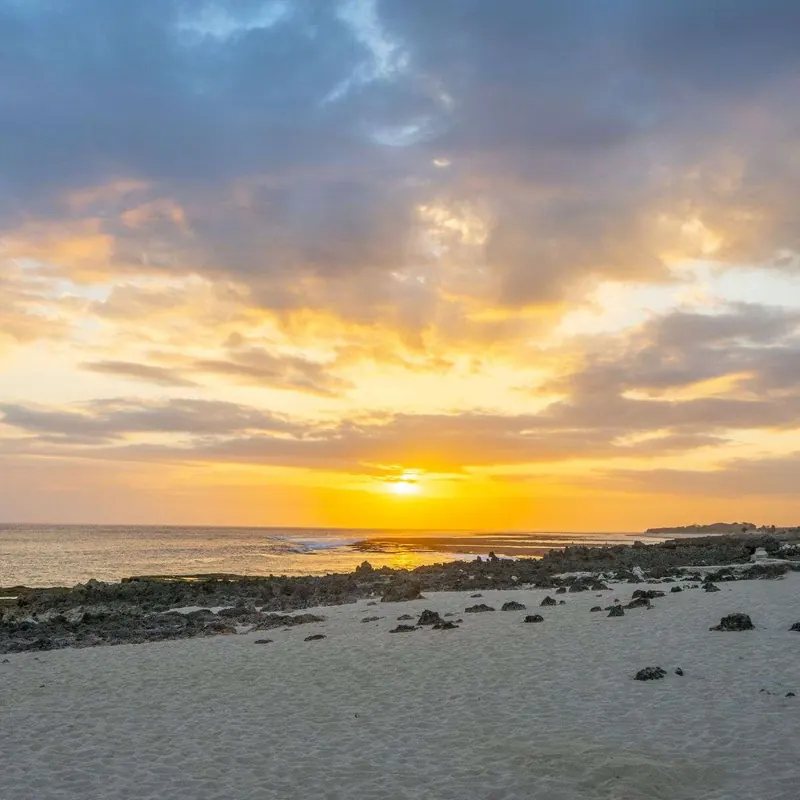 Sunset over the shore at Pero Beach