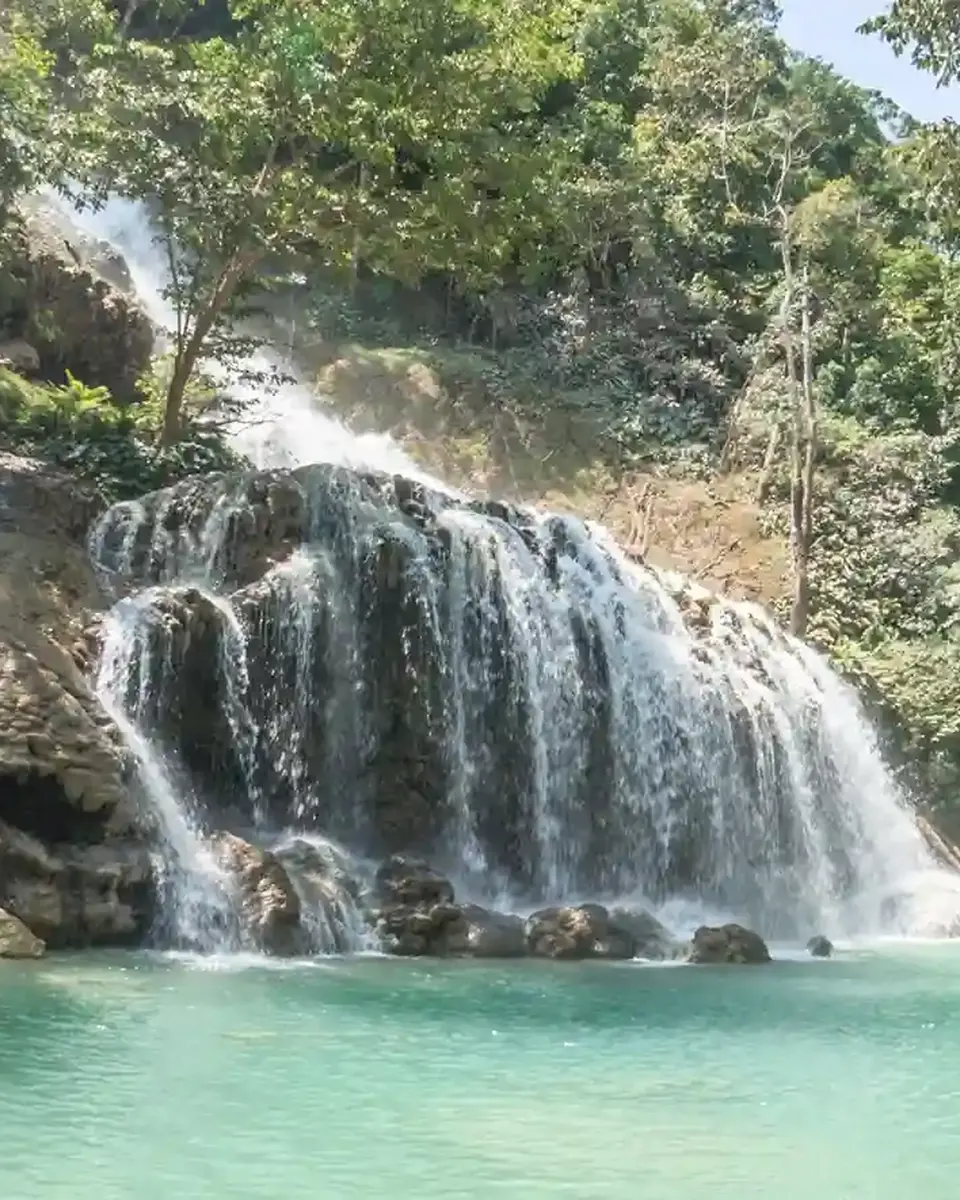 Lapopu Waterfall cascading over rock terraces, Sumba
