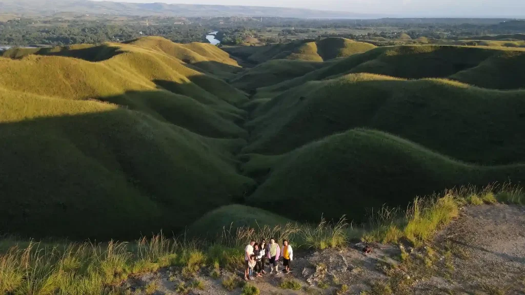 Drone photo of a group of friends on the ridges of Bukit Tenau in East Sumba