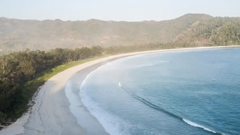 Aerial view of Tarimbang Beach in East Sumba with swell lines rolling into the bay