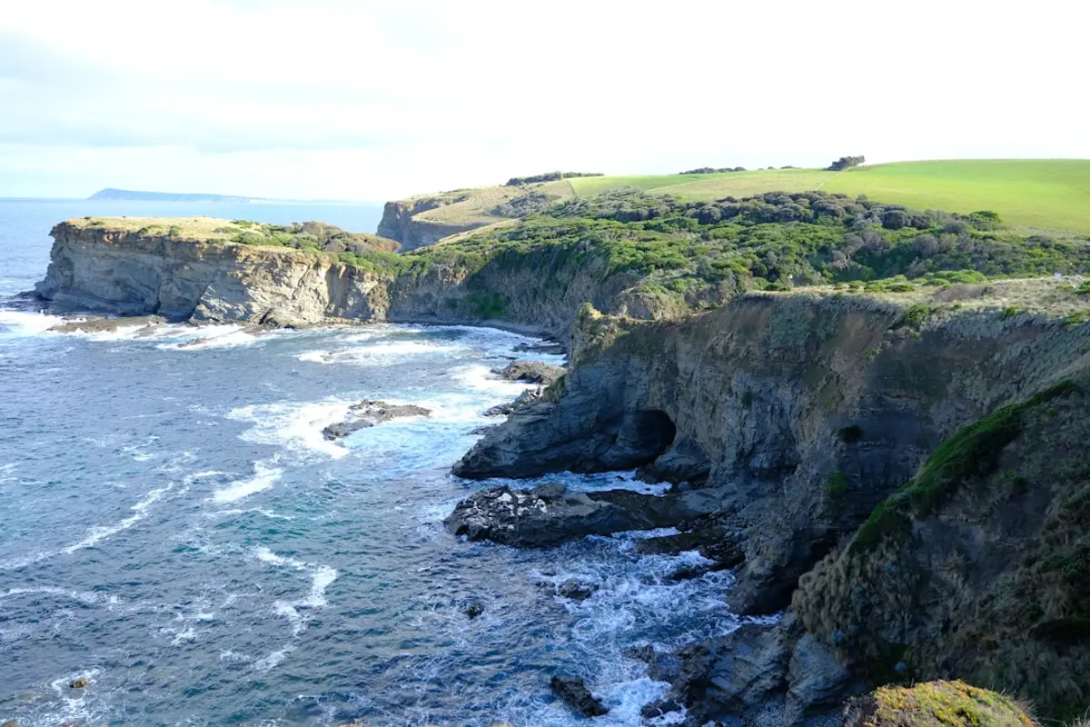 Rugged Sumba coastline with surf wrapping into a remote bay