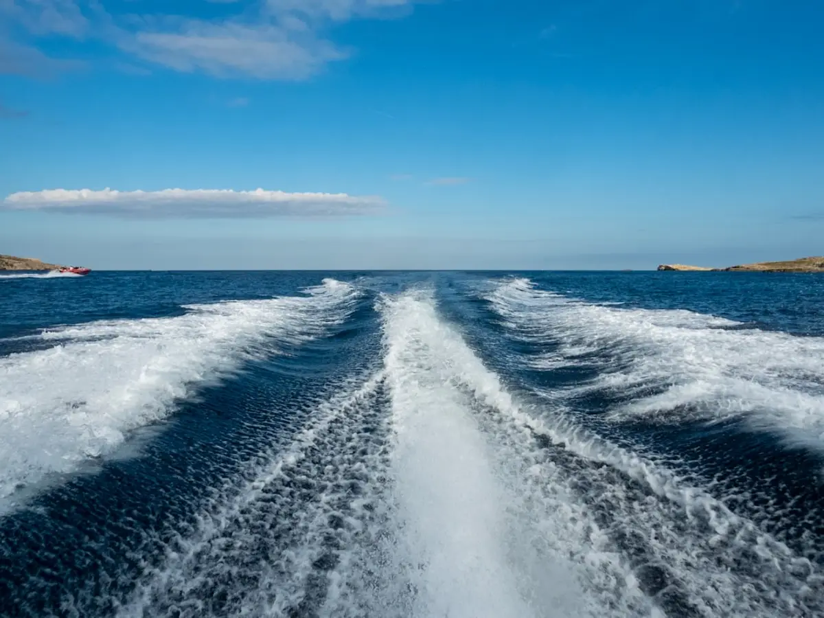A surf-charter speedboat running out to a boat-access reef break